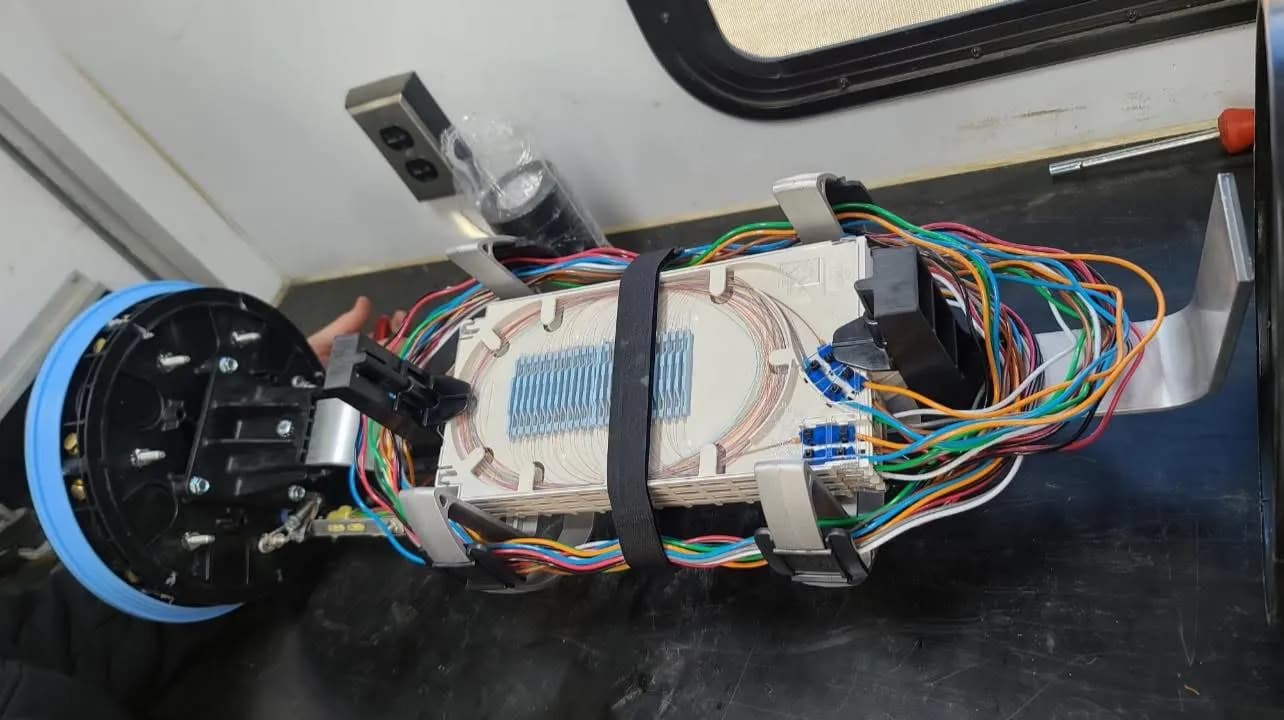 Technician performing precision fiber splicing